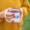 Lady holding cup of tea