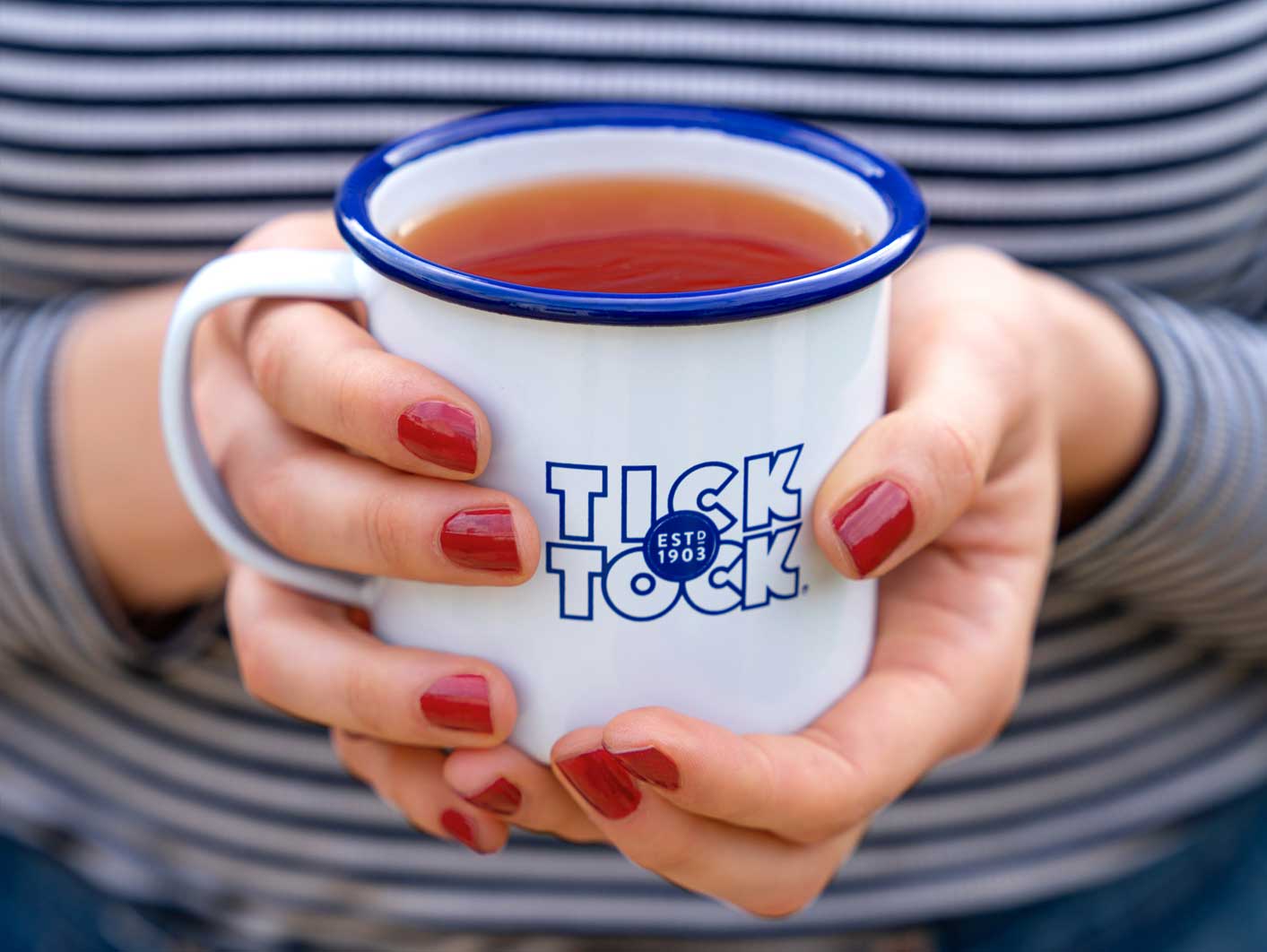 Lady holding mug of tea